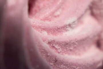 Abstract macro lines meringue. Colored sweet pink dessert zephyr or marshmallows in pastel colors. close-up, selective focus.