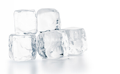 Natural ice cubes on white surface. Purity and refreshment concept.