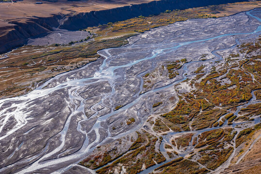 Braided rivers consist of islands occurs in rapid & frequent changes in river water,high sediment load & weak banks when a threshold level of sediment load or slope is reaches mainting steep gradient.