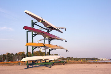Four rowing boats standing on metal stand