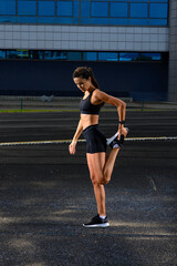 Fototapeta na wymiar Athlete runner running on athletic track training her cardio.