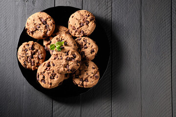 Homemade chocolate cookies on dark table