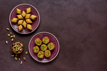 Traditional turkish, arabic sweets baklava assortment with pistachio. Top view, copy space