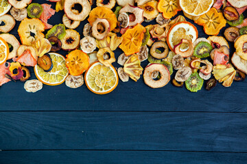 Organic Healthy Assorted Dried Fruit Mix close up. Dried fruit snacks. dried apples, mango, feijoa, dried apricots, prunes top view