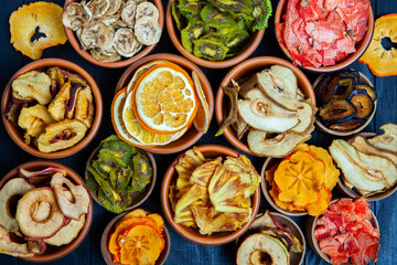 Organic Healthy Assorted Dried Fruit Mix close up. Dried fruit snacks. dried apples, mango, feijoa, dried apricots, prunes top view