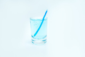 blue alcoholic drink in a decanter. Cocktail with blue gin , tonic