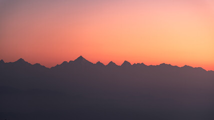 Mountain silhouette of Himalayas mountains during morning sunrise from Binsar, Kumaon region, Uttarakhand, India.