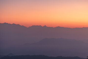 Mountain silhouette of Himalayas mountains during morning sunrise from Binsar, Kumaon region, Uttarakhand, India.