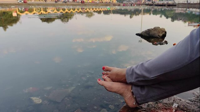 An Indian Women Relaxing Her Feet At The Bank Of Godavari River- 4K