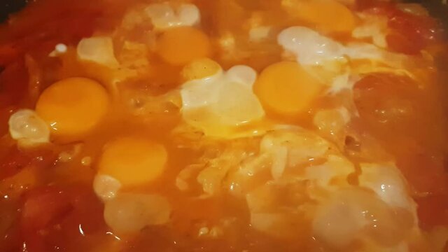 Cooking traditional Hungarian dish called lecs&oacute;