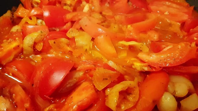 Cooking traditional Hungarian dish called lecs&oacute;