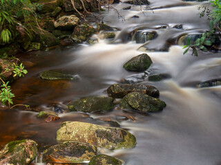 Longexposure photography of the stream of a river and the rocks near the town of Gachantiva in the central Andean mountains of Colombia.