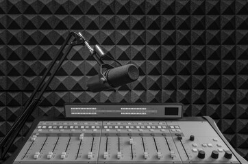 Background with professional microphone and sound mixer