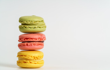 Colorful french macarons on background