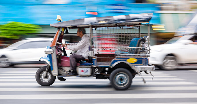 Bangkok rushing tuk tuk taxi in the city