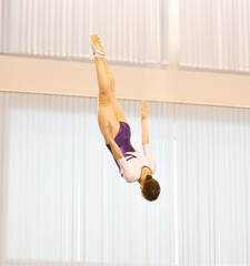 Girls train in trampoline jumping