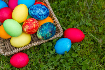 Happy Easter, colorful eggs in a basket