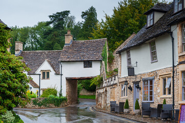Fototapeta na wymiar Step back in time and visit Castle Combs, quaint village with well preserved masonry houses dated back to 13 century. Castle Combe, a picturesque medieval village in England. UK.