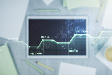 Double exposure of abstract creative statistics data hologram and modern digital tablet on background, analytics and forecasting concept