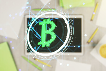 Creative Bitcoin concept and modern digital tablet on background, top view. Multiexposure