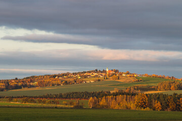 Obraz premium autumn landscape with a village on the hill, Svaty Jan, Czech republic