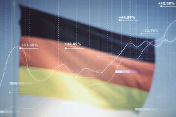 Double exposure of abstract creative statistics data hologram on flag of Germany and blue sky background, analytics and forecasting concept