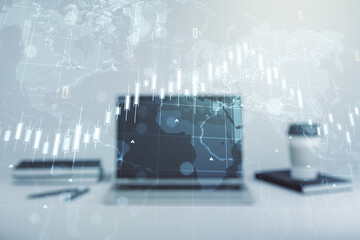 Double exposure of abstract creative financial chart with world map on laptop background, research and strategy concept