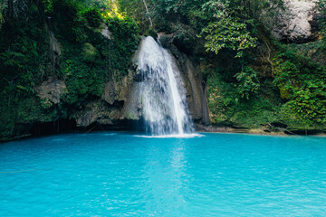 Fototapeta na wymiar The azure Kawasan waterfall in cebu. The maining attraction on the island. Concept about nature and wanderlust traveling