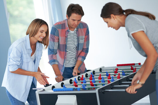 Group Of Students Playing Table Soccer In The Campus