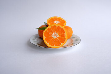 ripe and juicy tangerine (mandarin). cutaway tangerine fruit on a white background.
