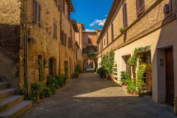 A quiet residential back street in the historic medieval village of Buonconvento, Siena Province, Tuscany, Italy
