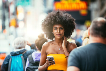 Young beautiful girl walking in Time square, manhattan. Lifestyle concepts about New york