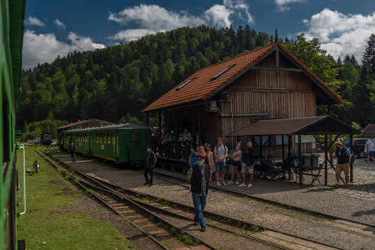 Narrow gauge railway in Majdan station with summer passengers in Poland