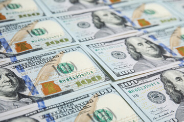 Many dollar banknotes as background, closeup view