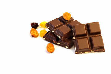 Delicious milk chocolate with almonds and raisins on an isolated white background.