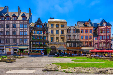 Street with timber framing houses in Rouen, Normandy, France. Architecture and landmarks of Rouen. Cozy cityscape of Rouen - obrazy, fototapety, plakaty