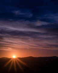 Beautiful sunset with a yellow and blue sky full of clouds