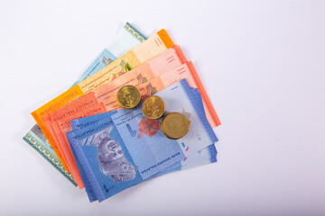 Stack Malaysia Bank note with coin on White Background.