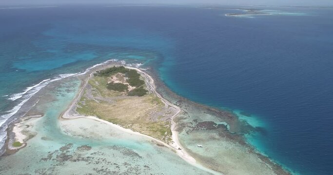 cankys island. Los roques Venezuela.  Aerial view, forward descending movement pan rigth