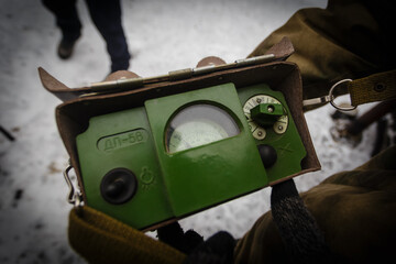 An old Soviet radimeter shows a small level of radiation pollution on the roof of one of the houses...