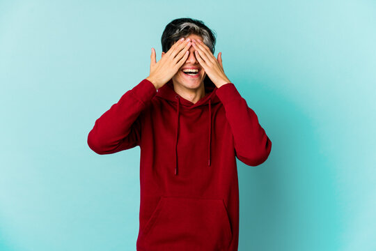 Young caucasian skinny man expressing emotions isolated on blue background