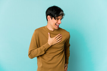 Young caucasian skinny man expressing emotions isolated on blue background