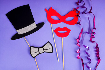 Carnival fun concept - Paper props on a purple background
