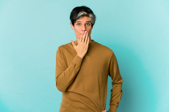 Young caucasian skinny man expressing emotions isolated on blue background