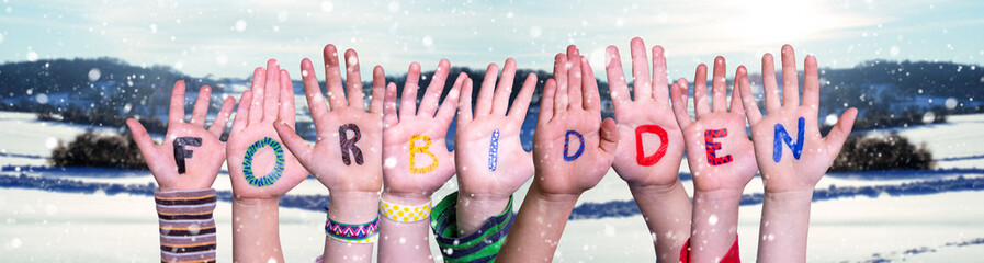 Children Hands Building Colorful English Word Forbidden. Snowy Winter Background With Snowflakes