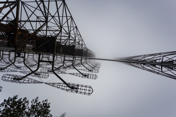 Soviet radar Duga in foggy weather. Russian woodpecker - over-the-horizon radar station near Chernobyl