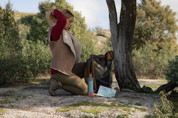 Girl sitting under the tree