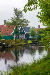 Fototapeta na wymiar Traditional Dutch house in Zaanse Schans. Small village in Amsterdam, Netherlands.