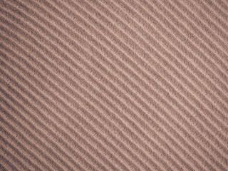 Background, texture, surface of wool knitted fabric from yarn, closeup. Image for the background, wallpaper. wool carpet or sweater. Gray texture. Modern design.