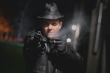 Fototapeta na wymiar Detective agent spy is aiming by the gun.